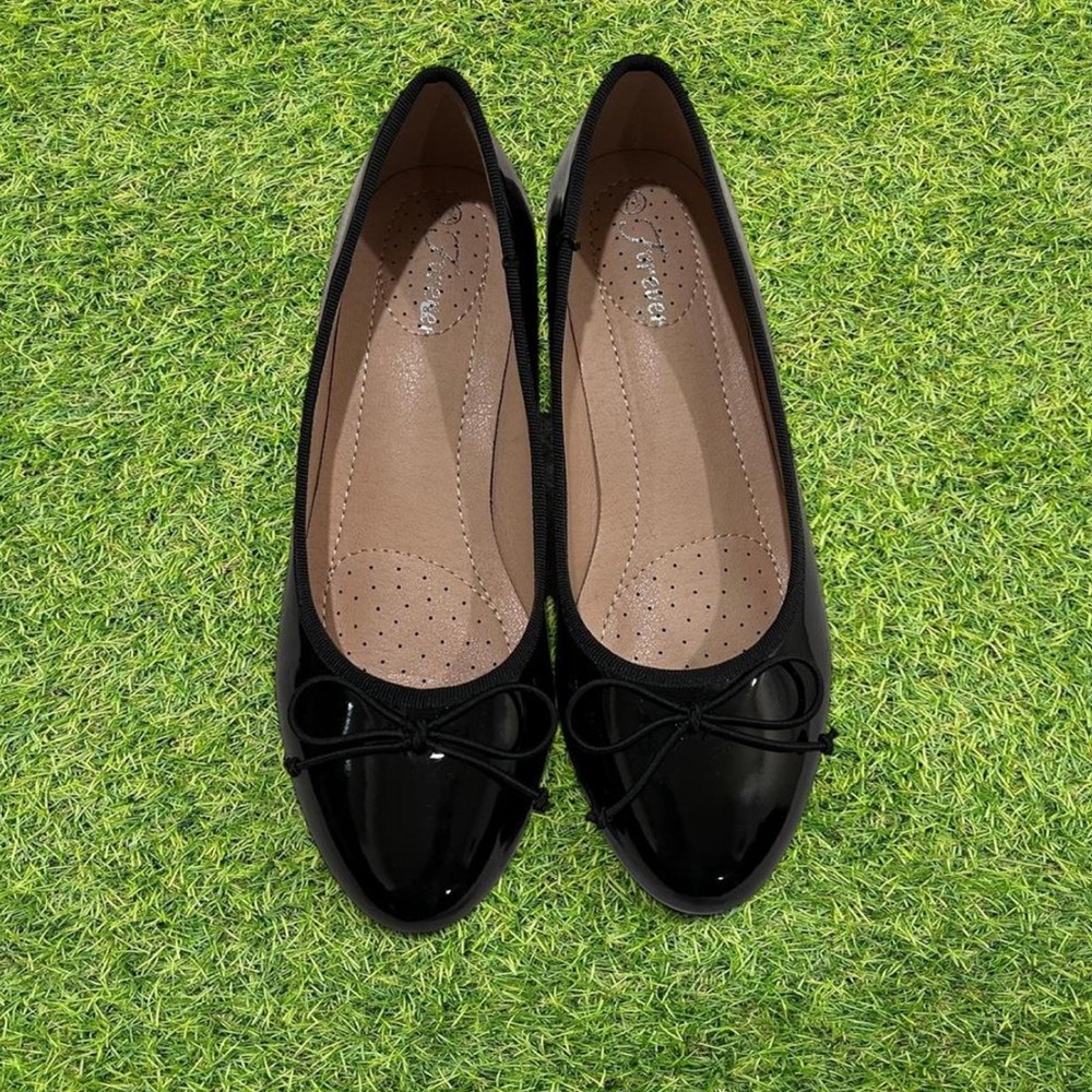 black classy flats with mini heel and bow on front